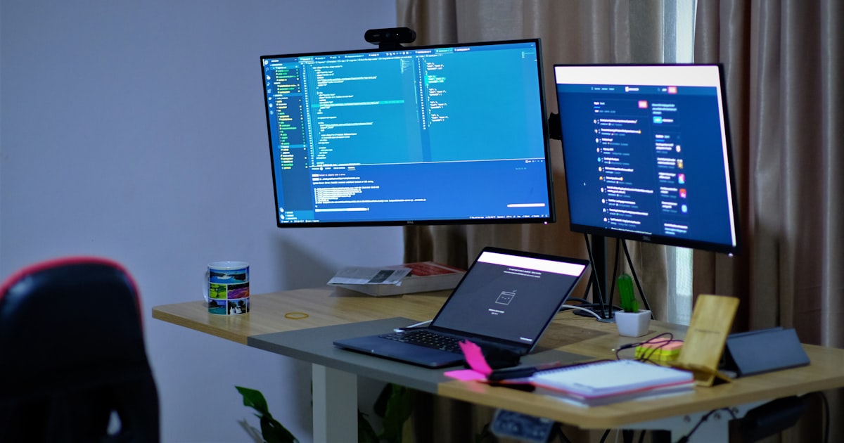 black flat screen tv turned on on white table