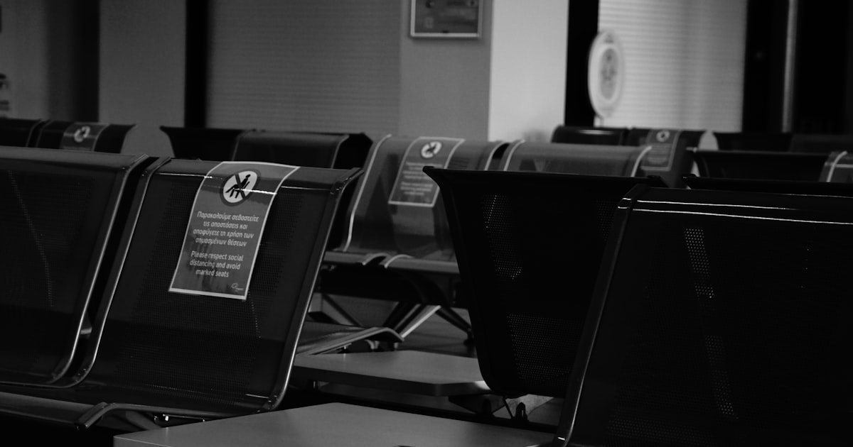 black laptop computer on black table