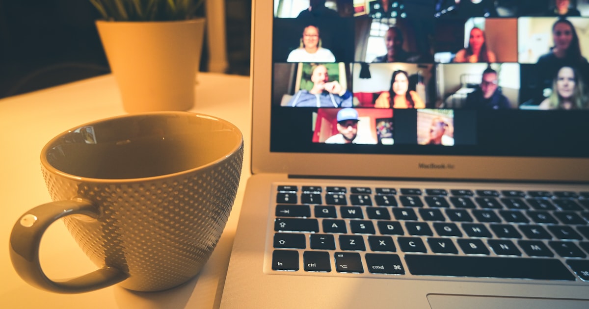 macbook air displaying woman in white shirt